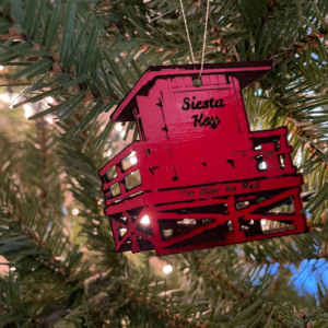 Siesta Key Beach red lifeguard stand ornament hanging in a Christmas Tree
